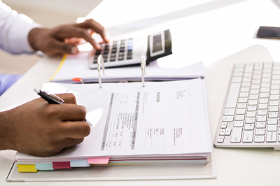 African American Accountant Doing Accounting And Tax